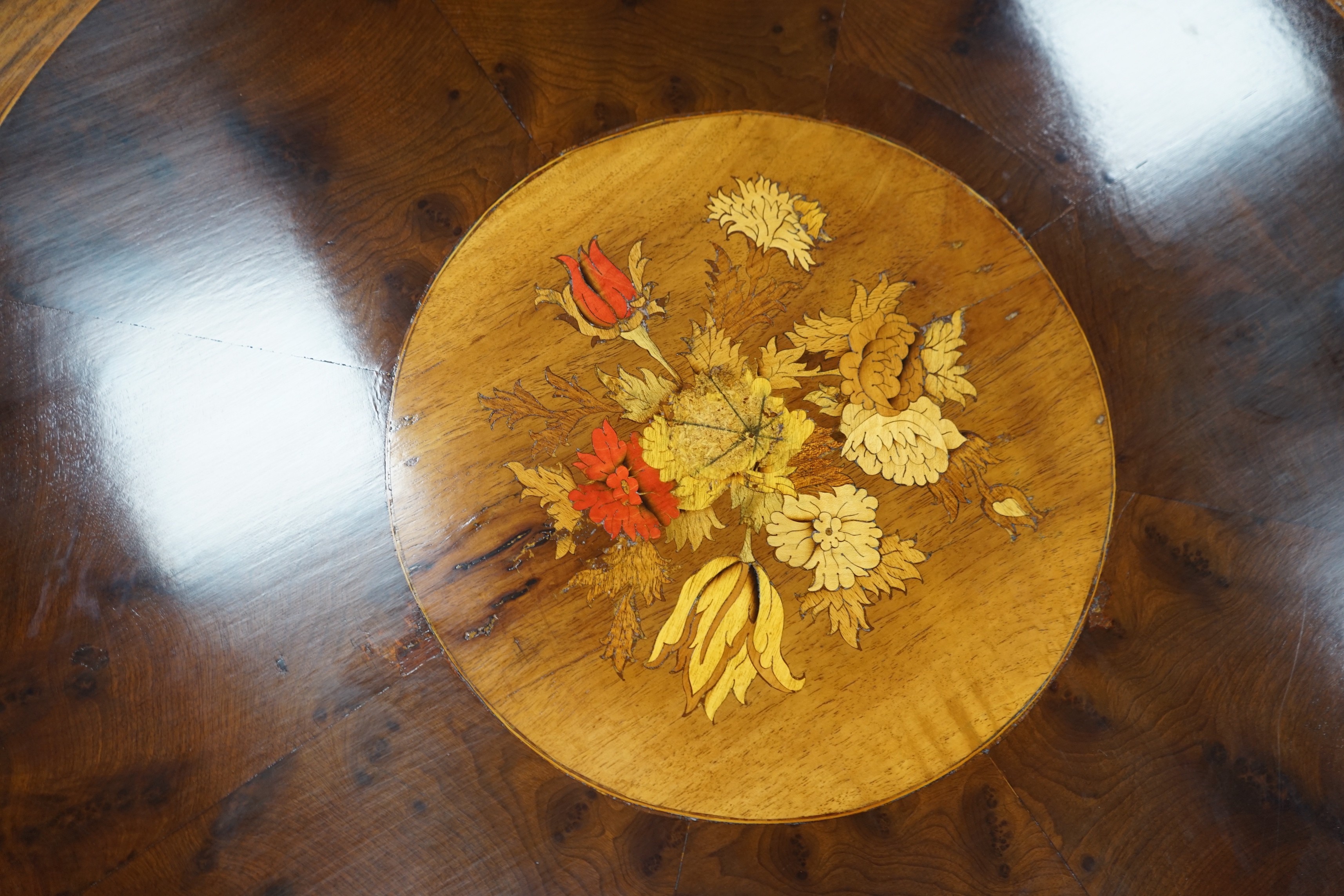 A Victorian style floral marquetry inlaid yew, walnut and rosewood circular breakfast table, diameter 130cm, height 72cm